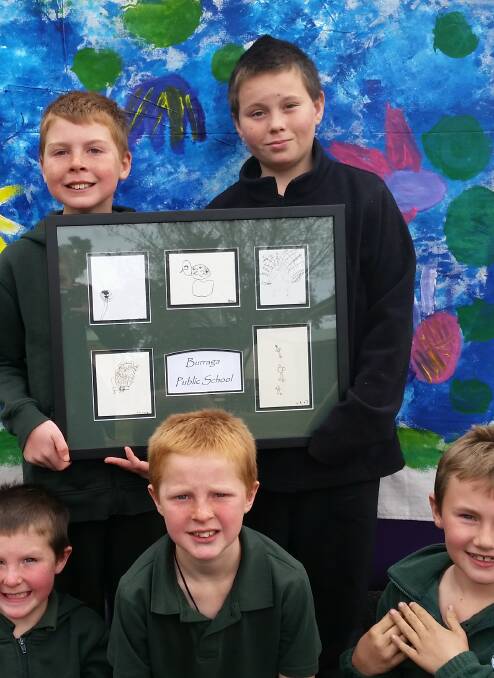 Creative: Proud students from Burraga Public School display their entries.