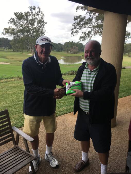 Nice Work: Col Brett being congratulated on his hole in one at Riverside Oaks by Mick English. 