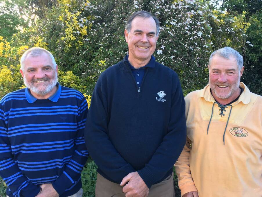 GRINNERS: Men's fourball runners-up Laurie Murphy and Barry Lang with Sean Mooney, who was one of the mixed fourball winners.