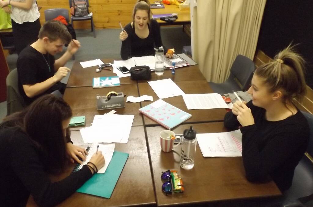 DRAMATIC TIME: HSC drama students Zenae, Mathew, Torii and Toriea doing last minute checking and revising of lines before their exam last Friday.