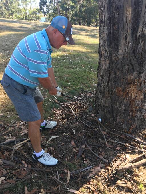 NOT EASY: John Crichton trying a backhander to get out of trouble. Members are reminded that the Macquarie Challenge (Veterans) and the Pro Am are coming up.