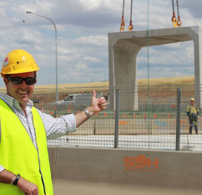 BIG JOB: Member for Bathurst Paul Toole examines work on the Great Western Highway upgrade at Kelso. The duplicated Boyd Creek Bridge is expected to be completed by October.