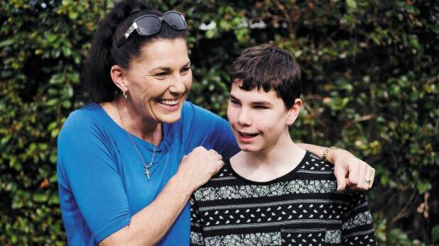 Ally McLeod with her son Connor McLeod, a 14-year-old who was born blind and convinced RBA to introduce tactile banknotes. Photo: James Brickwood