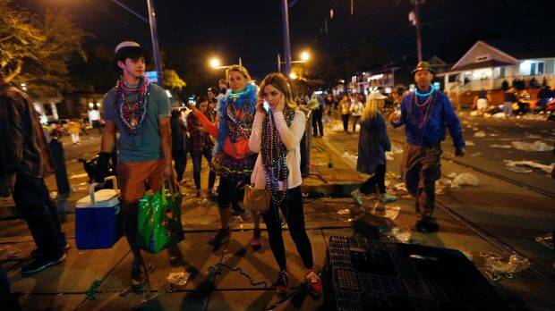 People leave the parade after the pick-up truck injured dozens. Photo: AP