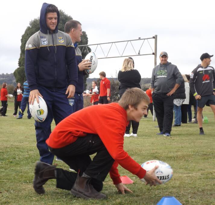LEARNING: Oberon High School Year 11 student Daniel Perry participates in a drill under the watchful eye of City Origin halfback Chad Townsend last week.
 