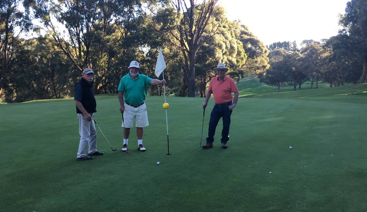 IN GOOD NICK: Oberon golf course is looking good. Golfers Brian Balaam, Mick English and David Slattery are putting on the 18th hole.