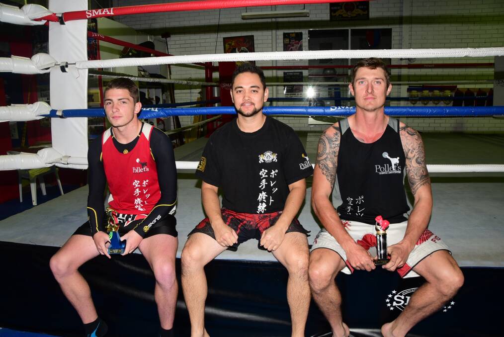 Sensei Matt March (centre) with martial artists Riley Barker and Lachlan Frankland who both had wins at The Battle at the Bron fight night. 							        Photo: KATHRYN O'SULLIVAN