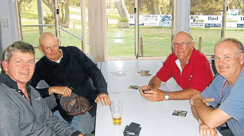 CATCH-UP: George Knight and Doug Curry entertaining their visitors on the 19th hole.