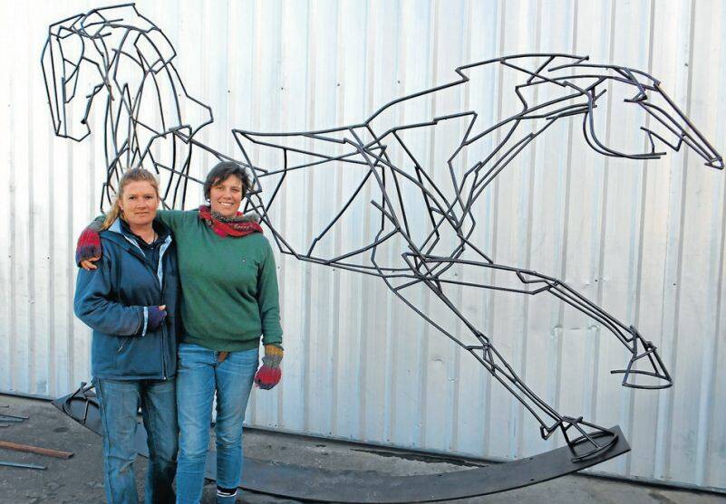 ON SHOW: Oberon sculptor Harrie Fasher (on right) with her latest work Which Way Forward which will be featured in this year's Sculpture by the Sea exhibition at Bondi in Sydney. She is pictured with her assistant steel fabricator Nicole O'Regan. 