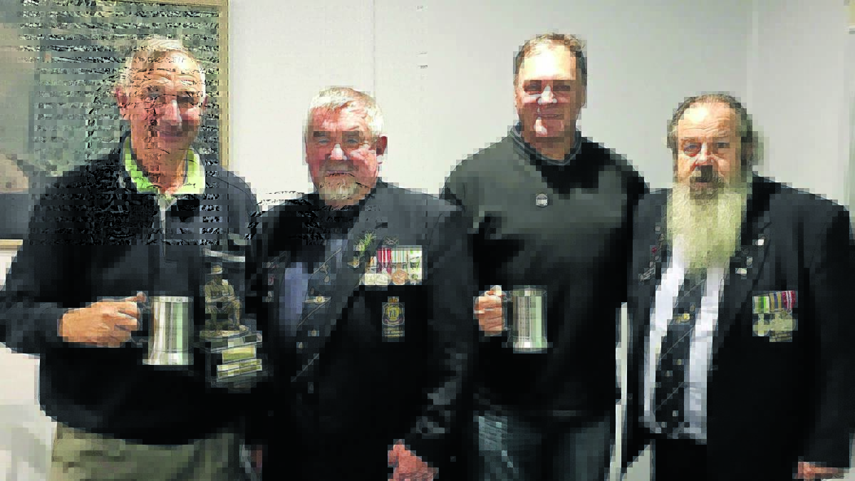 Dennis O’Connell, president of Oberon RSL Sub Branch Bill Wilcox, Alan Cairney, 
secretary of Oberon RSL Sub Branch Neville Stapleton enjoying a beer on ANZAC Day.