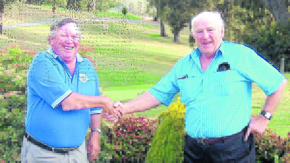 WELL DONE: Eric Whalan, sponsor of the second round of the championships, congratulates Anthony McGrath on a good day’s golf.