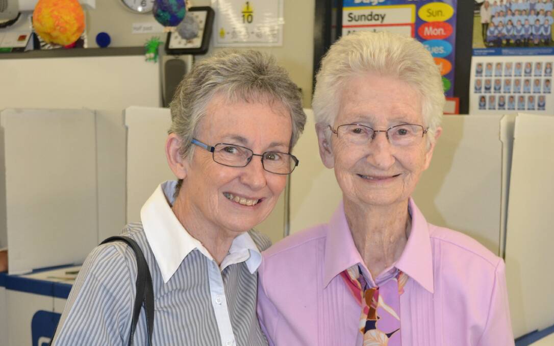 BIRTHDAY GIRL: We spotted birthday girl Eunice O'Donnell (right) at the Perthville Public School polling booth today. She had to interrupt her 97th birthday party to come along with her daughter Jan McGuire to vote. Photo: NADINE MORTON 032815nmvote26