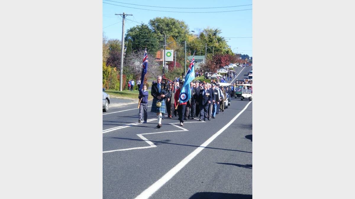 Residents march through Main Street to memorial
