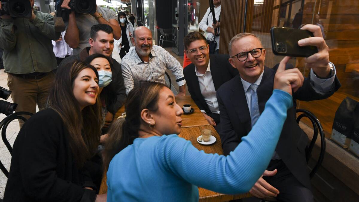 Labor leader Anthony Albanese on Thursday taking a selfie with voters. Picture: AAP