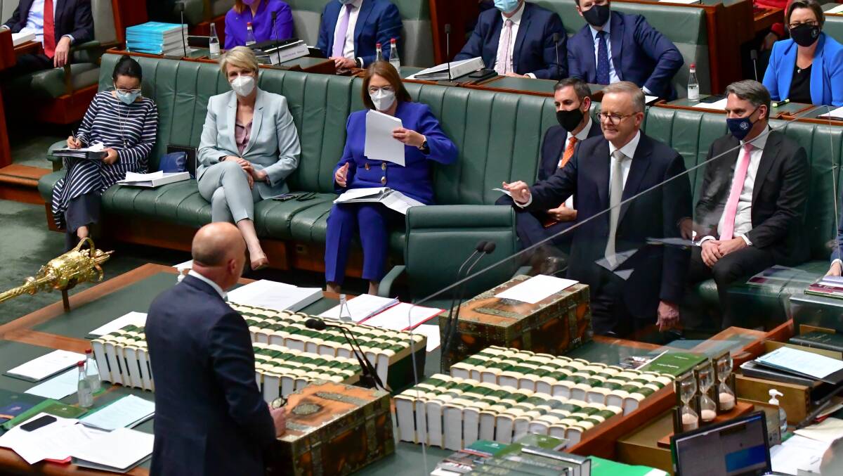 Prime Minister Anthony Albanese ushers opposition leader, Peter Dutton to sit down. Picture: Elesa Kurtz