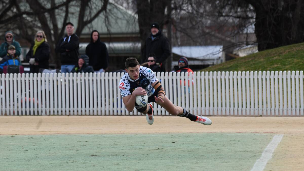 Harry Wald races in for a try in first grade. Picture by Carla Freedman