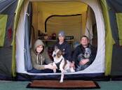Disability support worker Julieann Bailey, husband Richard, son Dylan, 16, and their two dogs Gizmo and Patch live in a tent at Country Capital Caravan Park just outside Canberra in Sutton, NSW. Picture: Lanie Tindale