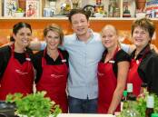 Jamie Oliver with workers from his 'Ministry of Food'. Picture: Jamie's Ministry of Food Australia