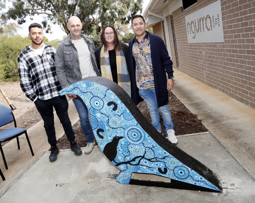 Artist Tyronne Hoerler (left to right), with Rob Leary, Sally-Anne Brennan and Duval Martinez, unveiling the work of art which now stands at the Ngurra Hub entrance. Picture: Les Smith