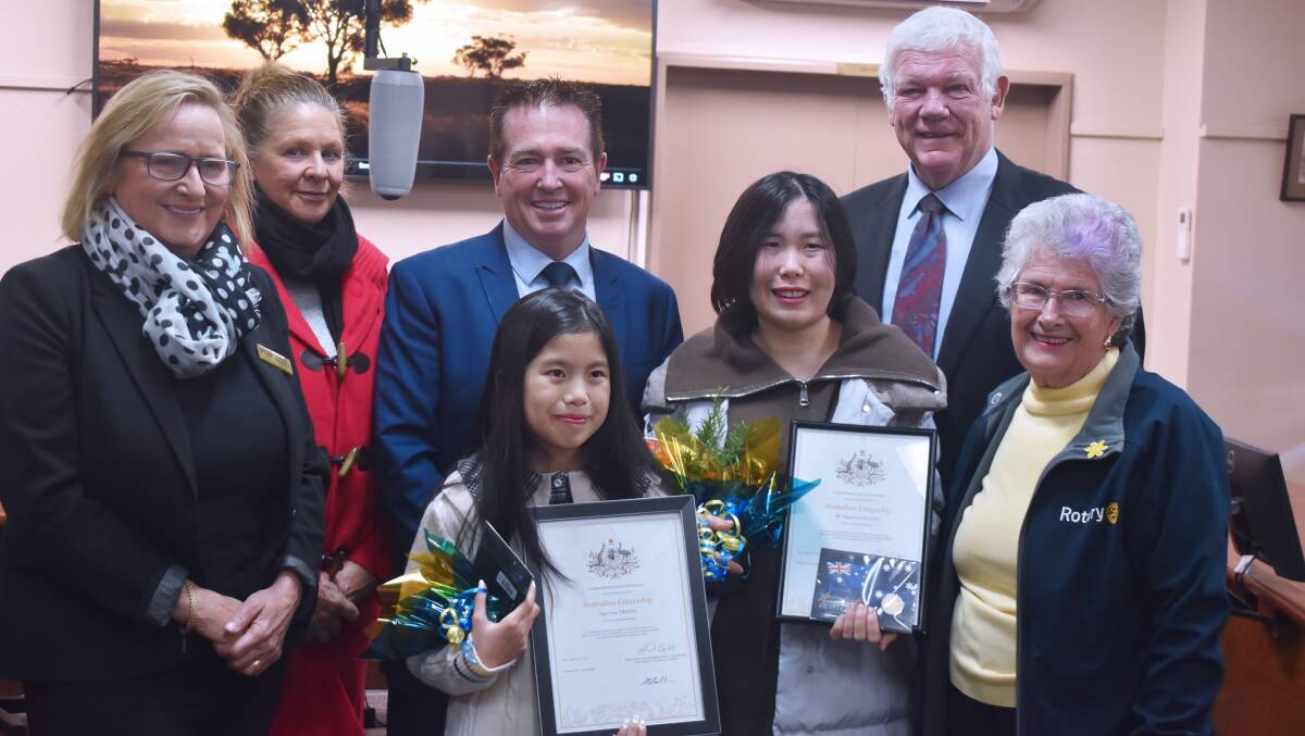 Councillors Lauren Trembath and Helen Hayden, Paul Toole MP, Ngoc Lam Truong, Thi Thanh Van Nguyen, Mayor Mark Kellam and Rotary's Brenda Lyon celebrate the occasion. Photo Peter Bowditch