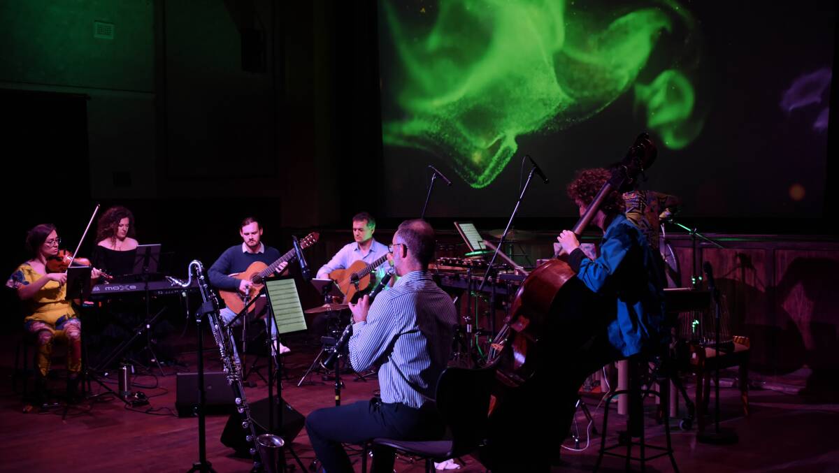 Ensemble Offspring with video by Paul Mosig on the big screen. Photo Peter Bowditch