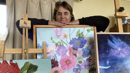 Lyn Martin with a collection of her art. Picture supplied