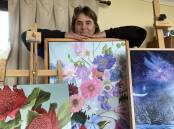 Lyn Martin with a collection of her art. Picture supplied