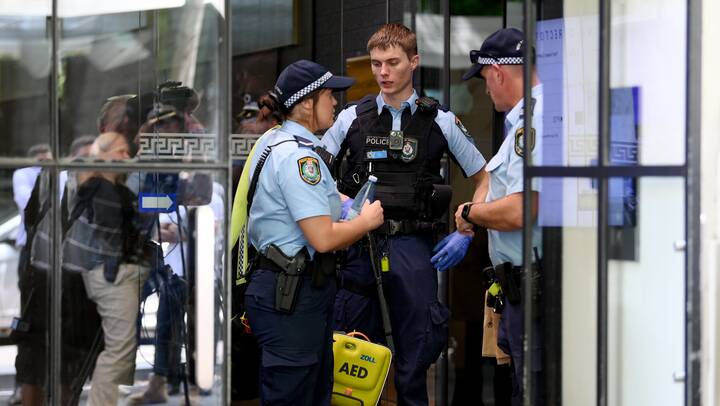 NSW Police on Castlereagh Street in Sydney after a shooting on February 28, 2024. Police arrested a man while paramedics took the shot man to hospital. Picture AAP Image/Bianca De Marchi