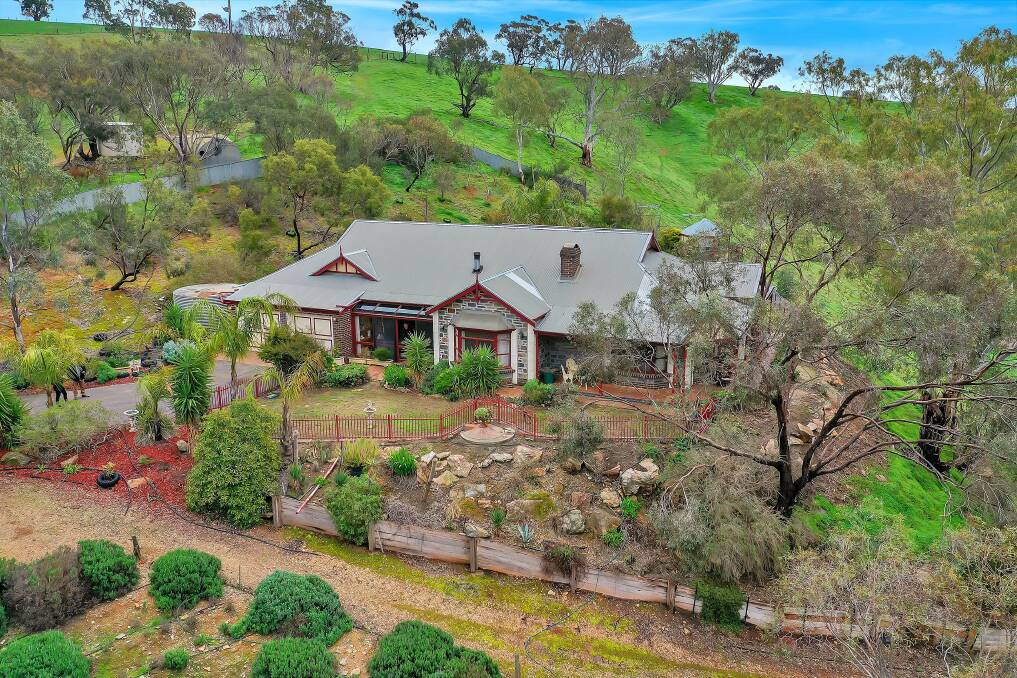 ON THE MARKET: A chance to own one of the Barossa's biggest olive groves, but also a solid brick federation-style home with elevated views.
