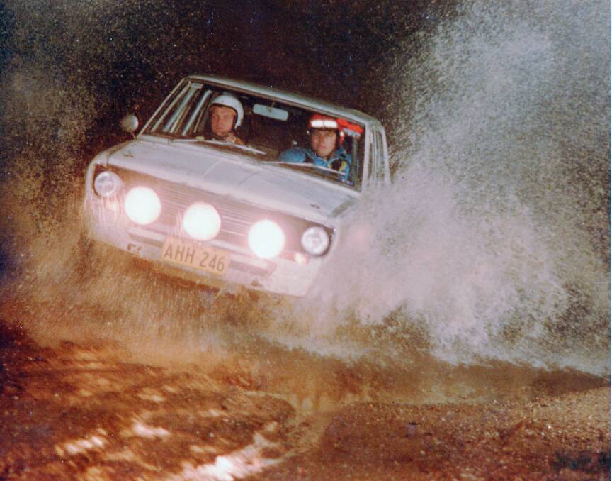 HOLD ON TIGHT: Peter Bowditch's Datsun surfing through a creek in Vulcan State Forest in the University Car Club Winter Rally in August 1979.