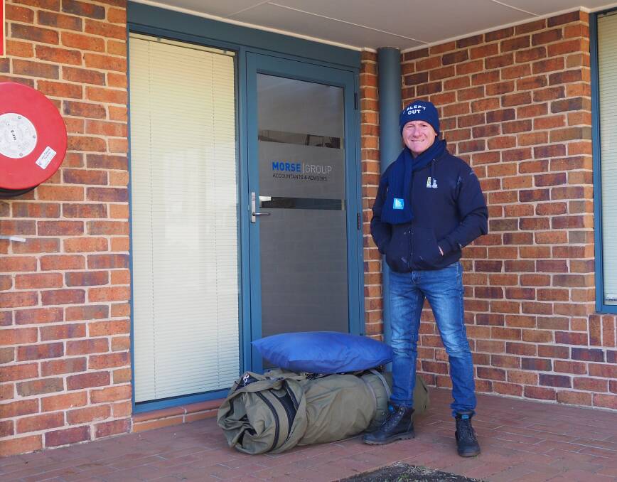 HARD NIGHT: Morse Group managing partner Justin Enright getting ready for the Vinnies CEO Sleepout last year.