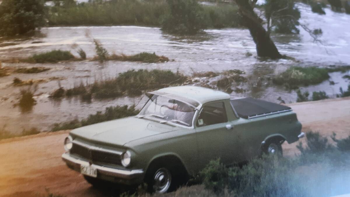 WATER VIEW: A flash flood and a new EH Holden ute revive memories.