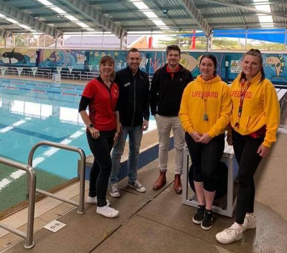 DIVE IN: Staff at the opening day for the pool, which is now being managed by YMCA NSW.