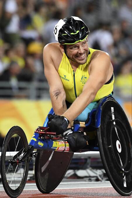 ANOTHER HONOUR: Carcoar's Kurt Fearnley, pictured after winning the men's 1500 metres silver medal at the Commonwealth Games, has been named an Officer of the Order of Australia. Photo: AAP