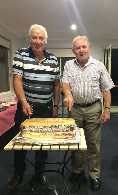 MILESTONE MOMENT: Life members Peter Dale and Kevin McGrath cut the 60th birthday cake for the Oberon Golf Club.
