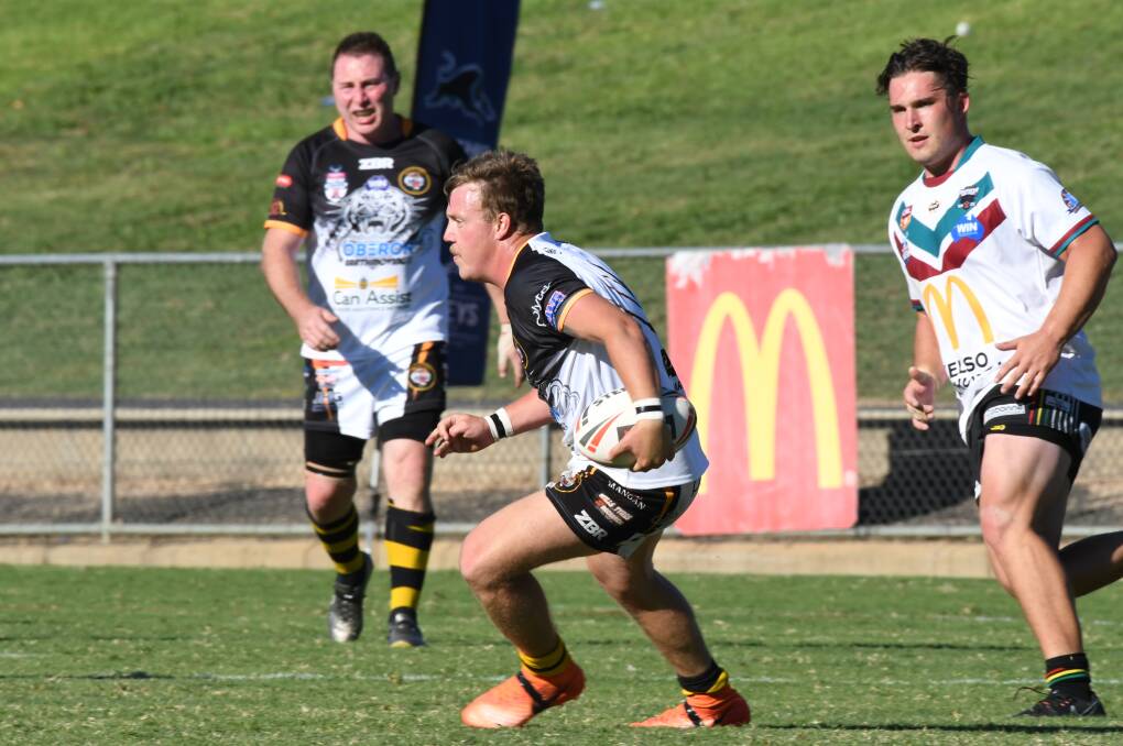 JUST SHORT: Oberon fullback Blake Fitzpatrick looks for a gap in Panthers' line during the knockout final. The Tigers went down by four points. Photo: CHRIS SEABROOK