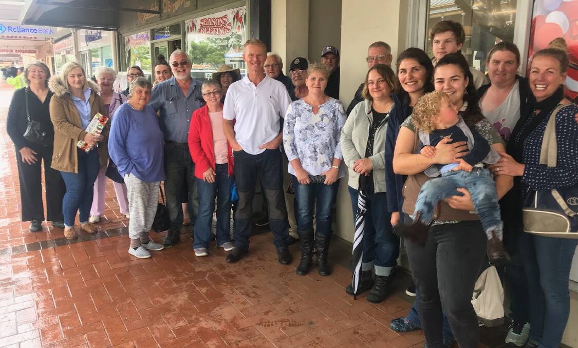 VALE: Chris Freeman (in white T-shirt, front and centre) at the rally to support Wayne and Bernice Keft from Oberon Post Office in December 2018.
