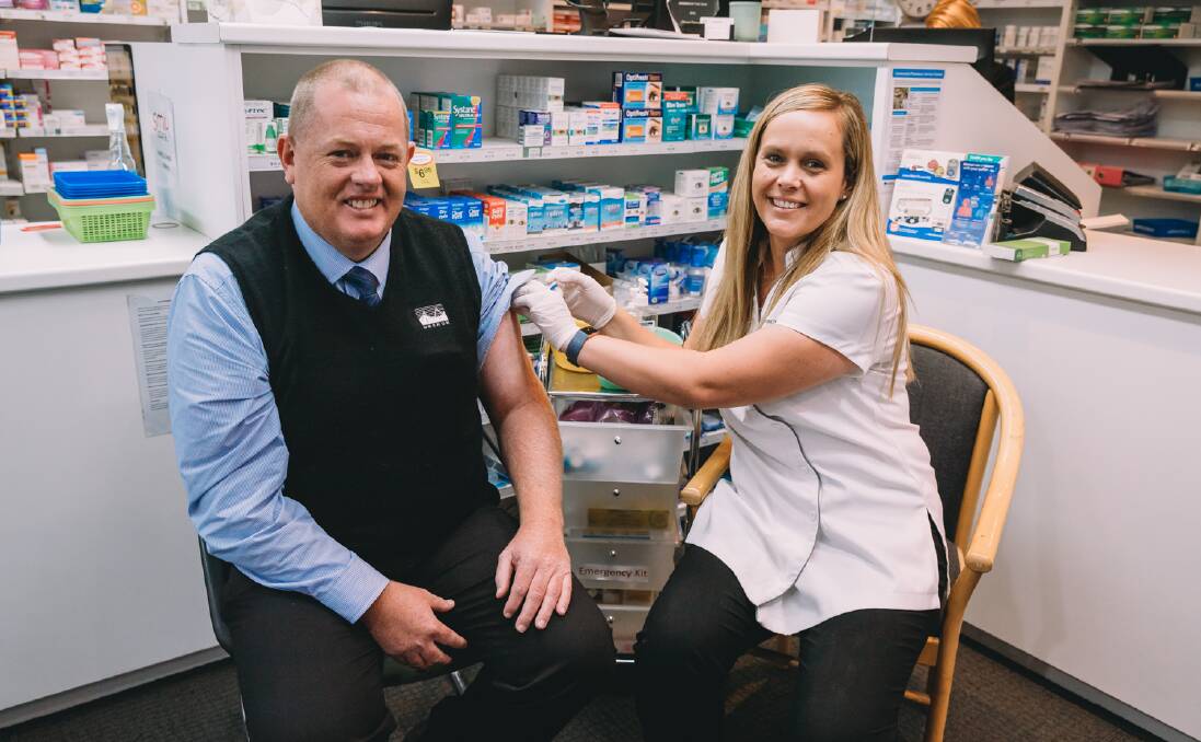 THAT'S THE SHOT: Pharmacist Jenny Stoneman vaccinates Oberon Council general manager Gary Wallace.