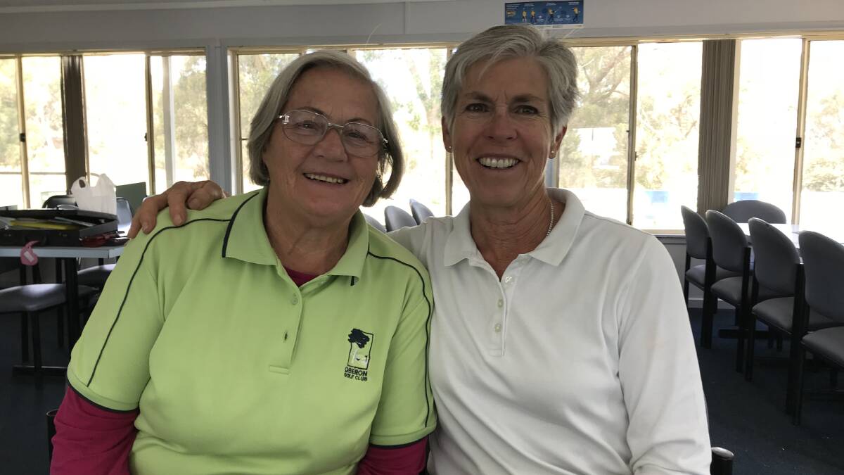 SMILES: Division 2 winner Barbara Coleman and Division 1 winner Jenn Capel. The fairways have grassed up a little for golfers.