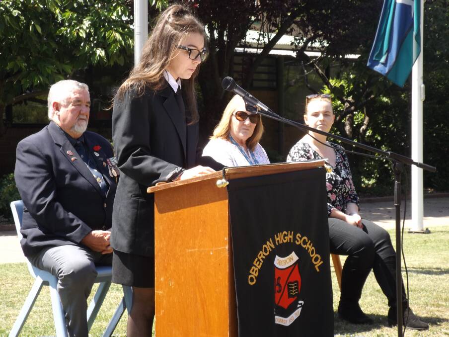 MOVING: Bailey Armstrong addresses the Remembrance Day assembly while Bill Wilcox, Sandra Mackay-Galea and Holly McTrustry look on.