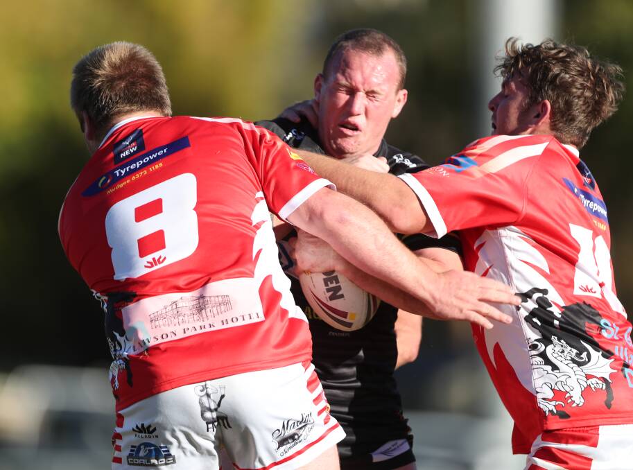 IMPACT: Bathurst Panthers prop Brent Seager charges at the Dragons' defence. Both matches between the pair this season have been decided by four points or less. Photo: PHIL BLATCH