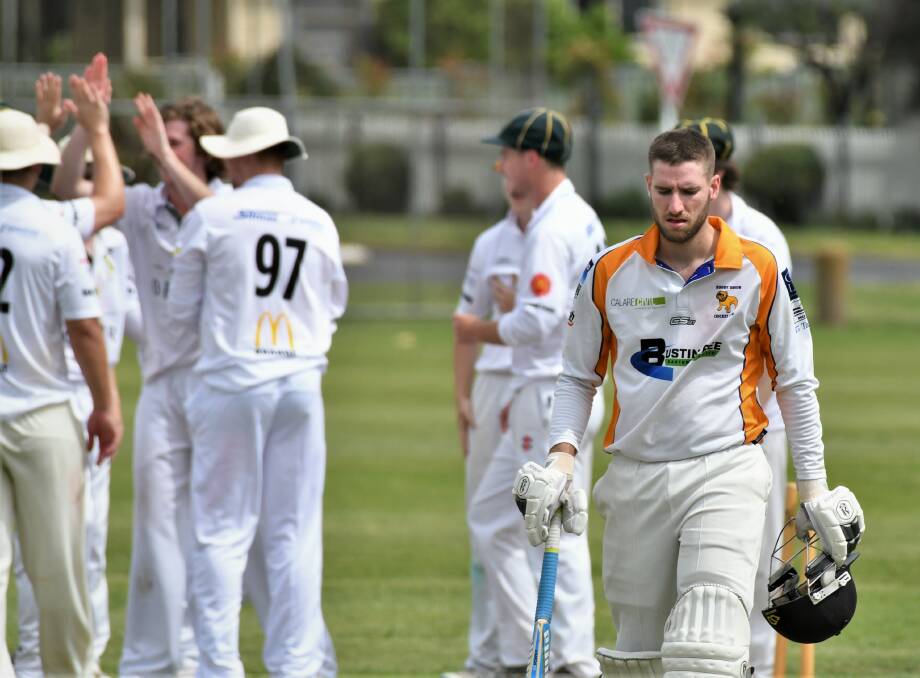 YOU'RE OUT: CYMS celebrate the dismissal of Rugby's Lachlan Coad on Saturday. Photo: CHRIS SEABROOK