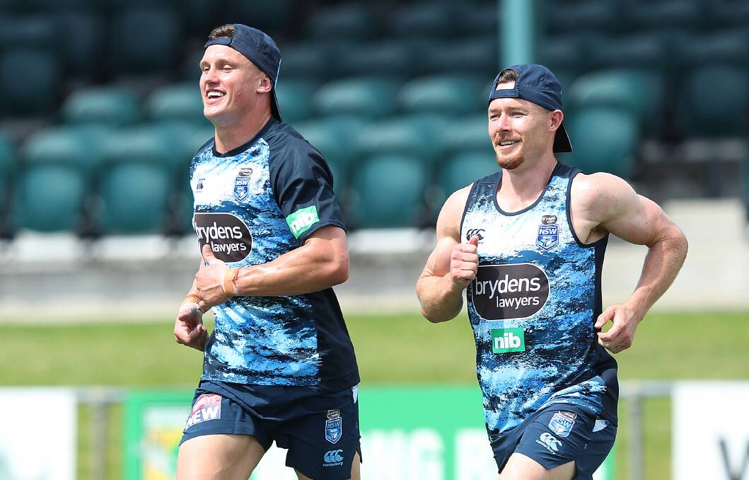 ON THE RUN: Jack
Wighton and Damien
Cook: Photo: NSWRL