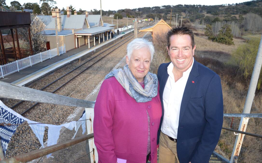 GOOD NEWS: Oberon mayor Kathy Sajowitz with Bathurst MP Paul Toole at Tarana railway station celebrating the debut bullet run in September 2019.