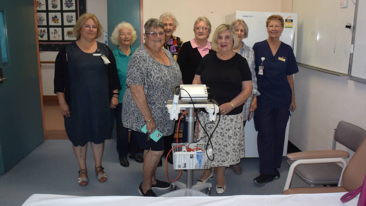 HELP: Oberon Hospital manager Alexandria Woods, auxiliary members Margaret Farquarson, Jill Baxter, Lurline Ralls, Judy Haslop, Anabelle Gilbert, Jan Hazelwood and nurse manager Karen Mathews with the new bladder scanner in February, 2020. 