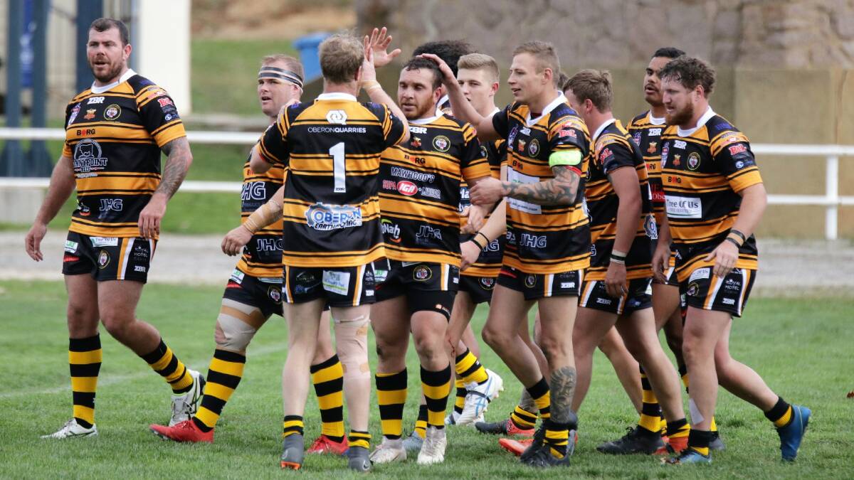 HIGH FIVE: Oberon Tiger's premier division celebrate their win against Lithgow Workies on Sunday.