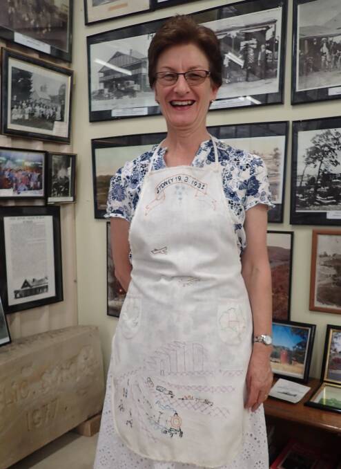 1932: Deborah Hoolihan wears her great aunt's embroidered apron. 