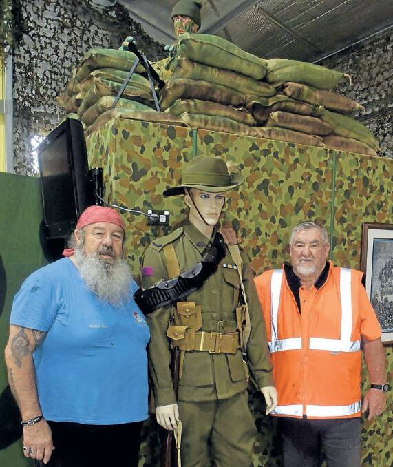 MOre: Oberon RSL Sub Branch Military Museum secretary Neville Stapleton and president Bill Wilcox with part of their new memorabilia displays.