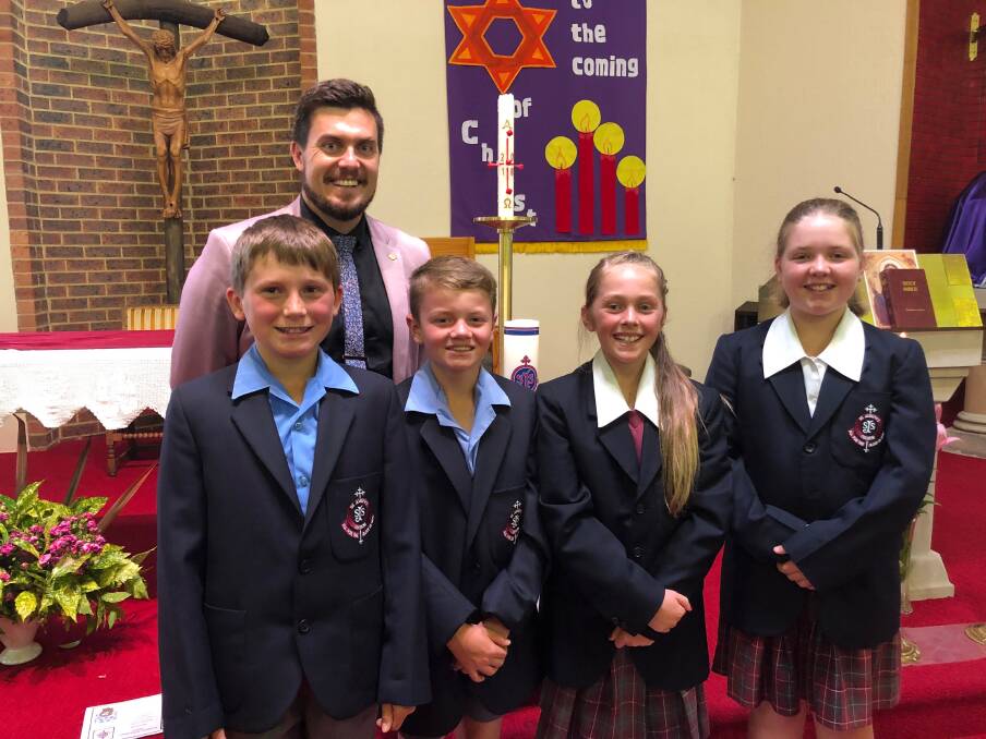 All Welcome: St Josephs students, along with Principal Jaydem Hadson, invite families, friends and the community to celebrate Catholic Schools week with them. Photo: Supplied.