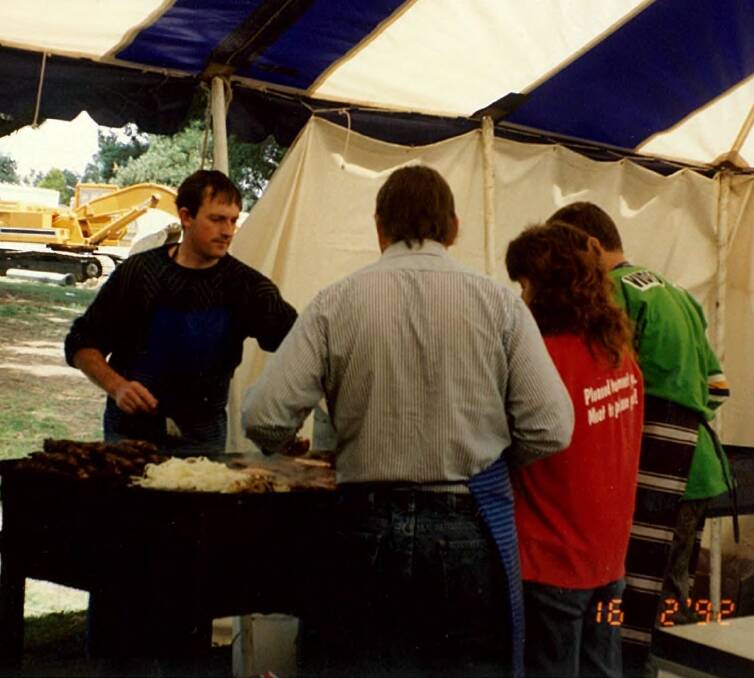 SERVE IT UP: Flashback to 1992 where Wayne dons his apron once again to man the barbie at the Oberon Show, cooking up a storm to feed the hungry patrons.